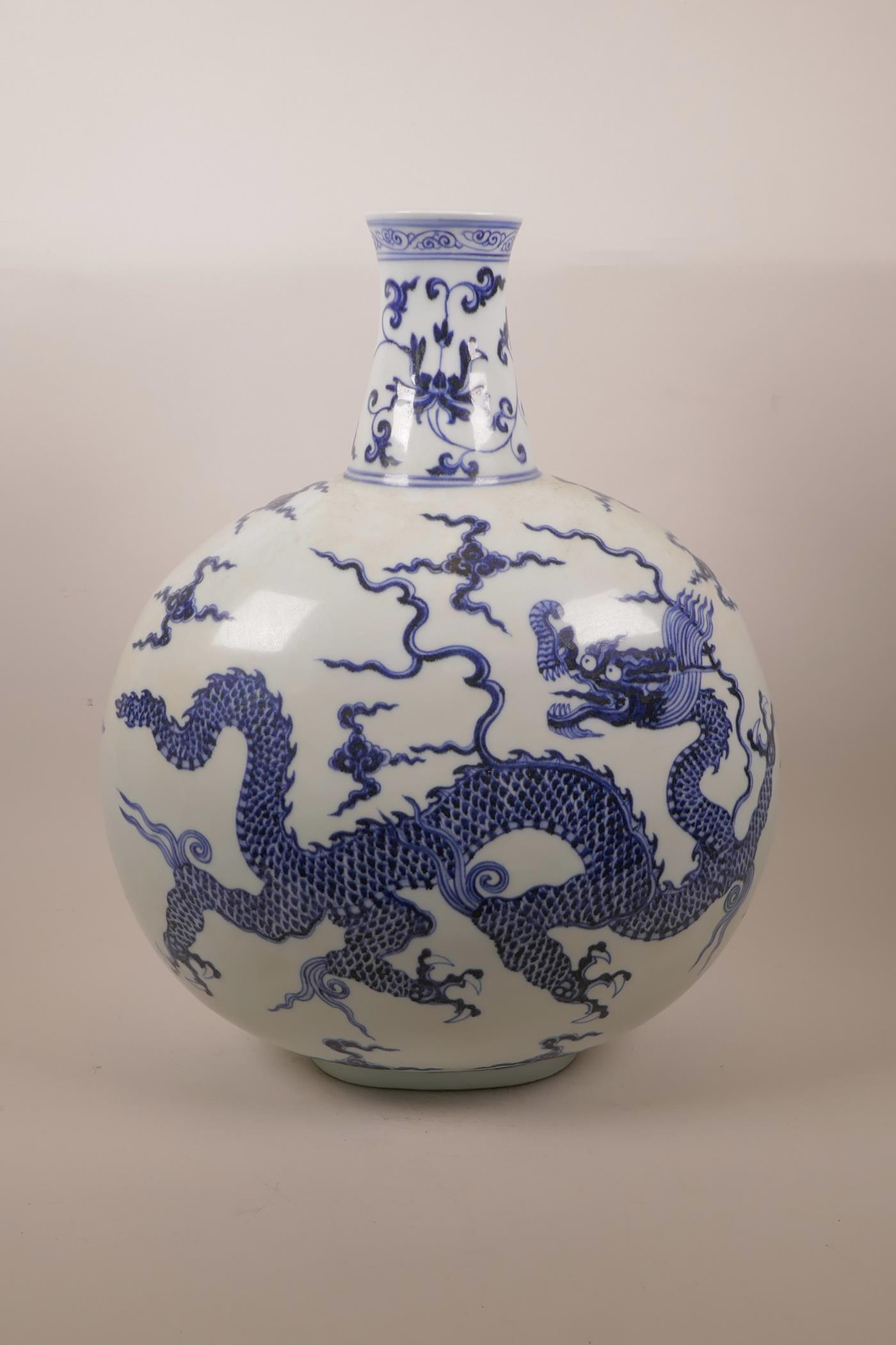 A Chinese blue and white porcelain moon flask decorated with a dragon in flight, six character