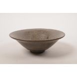 A Chinese Cizhou kiln pottery bowl with a grey glaze, 5½" diameter