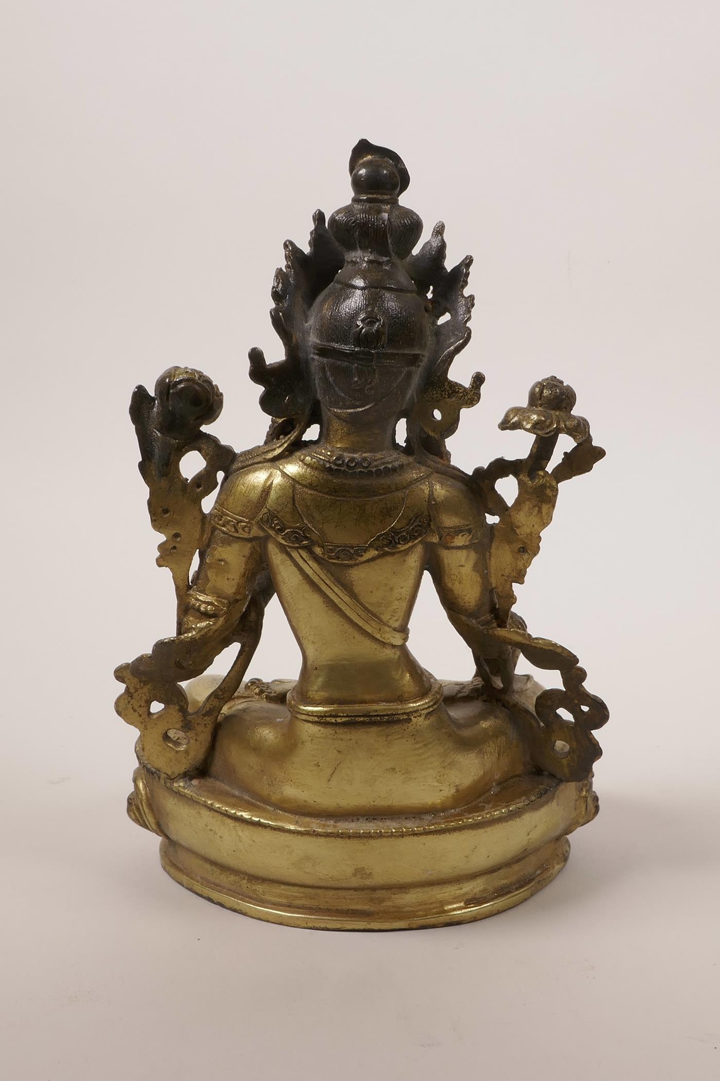 A Chinese gilt bronze Buddha seated on a lotus throne, impressed double vajra mark to base, 8"high - Image 2 of 3