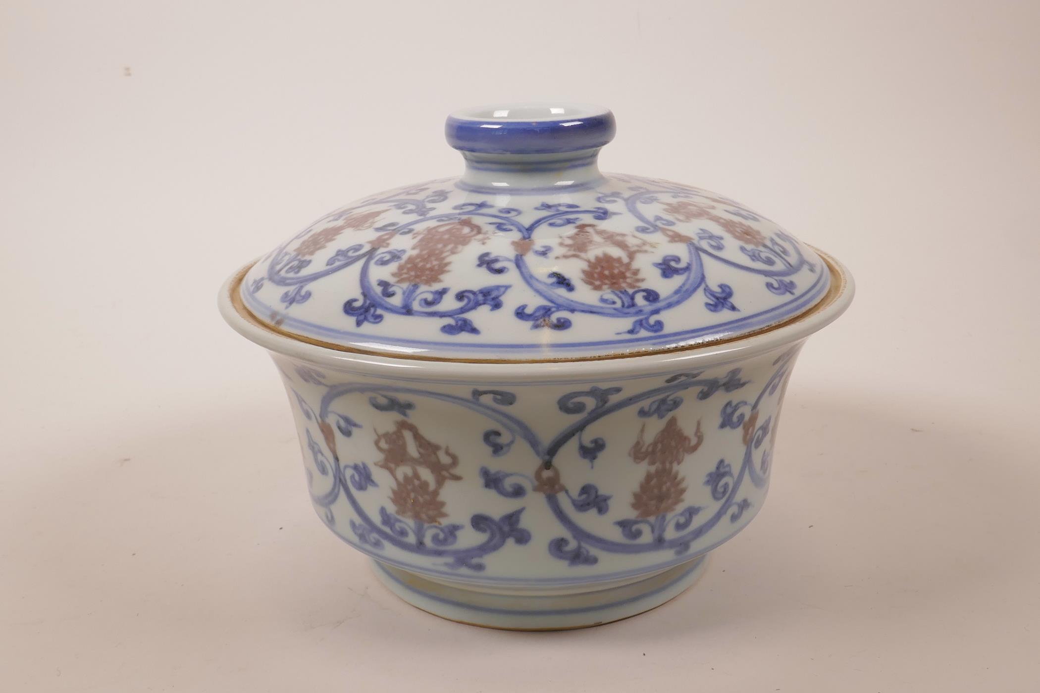 A Chinese blue, white and red porcelain pot and cover decorated with lotus flowers and the emblems - Image 3 of 7