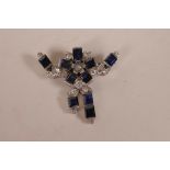 An Art Deco white metal brooch set with ten sapphires and sixteen diamonds, unmarked, 11.1 grams