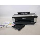 An Epsom Stylus Photo R2880 printer with manuals