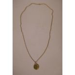 A 9ct gold chain with replica guinea pendant, gross 17.2 grams