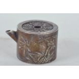 A Chinese silvered metal miniature teapot with raised character and bamboo decoration, 2" diameter