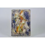 A Chinese Sancai glazed pottery tile with raised decoration of a musician, 7" x 10"
