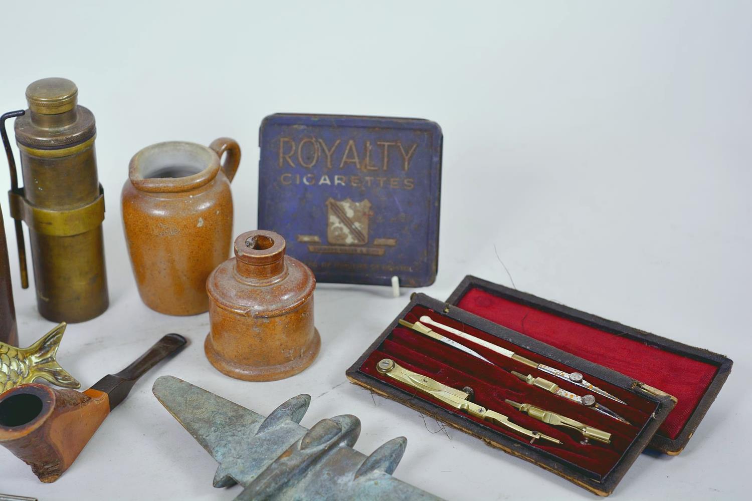 A box of collectables including a brass model Mosquito aircraft, Royalty cigarette tin, drawing set, - Image 8 of 11