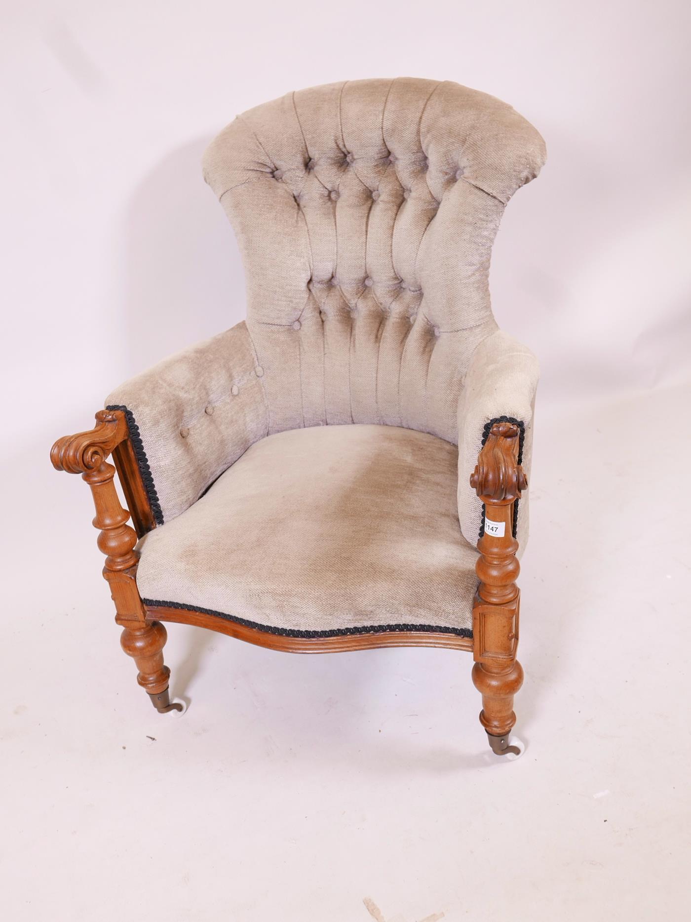 A C19th walnut show frame armchair with scrolled arms and serpentine front, raised on turned - Image 2 of 3