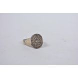 A Viking bronze signet ring, the face with runic engraving
