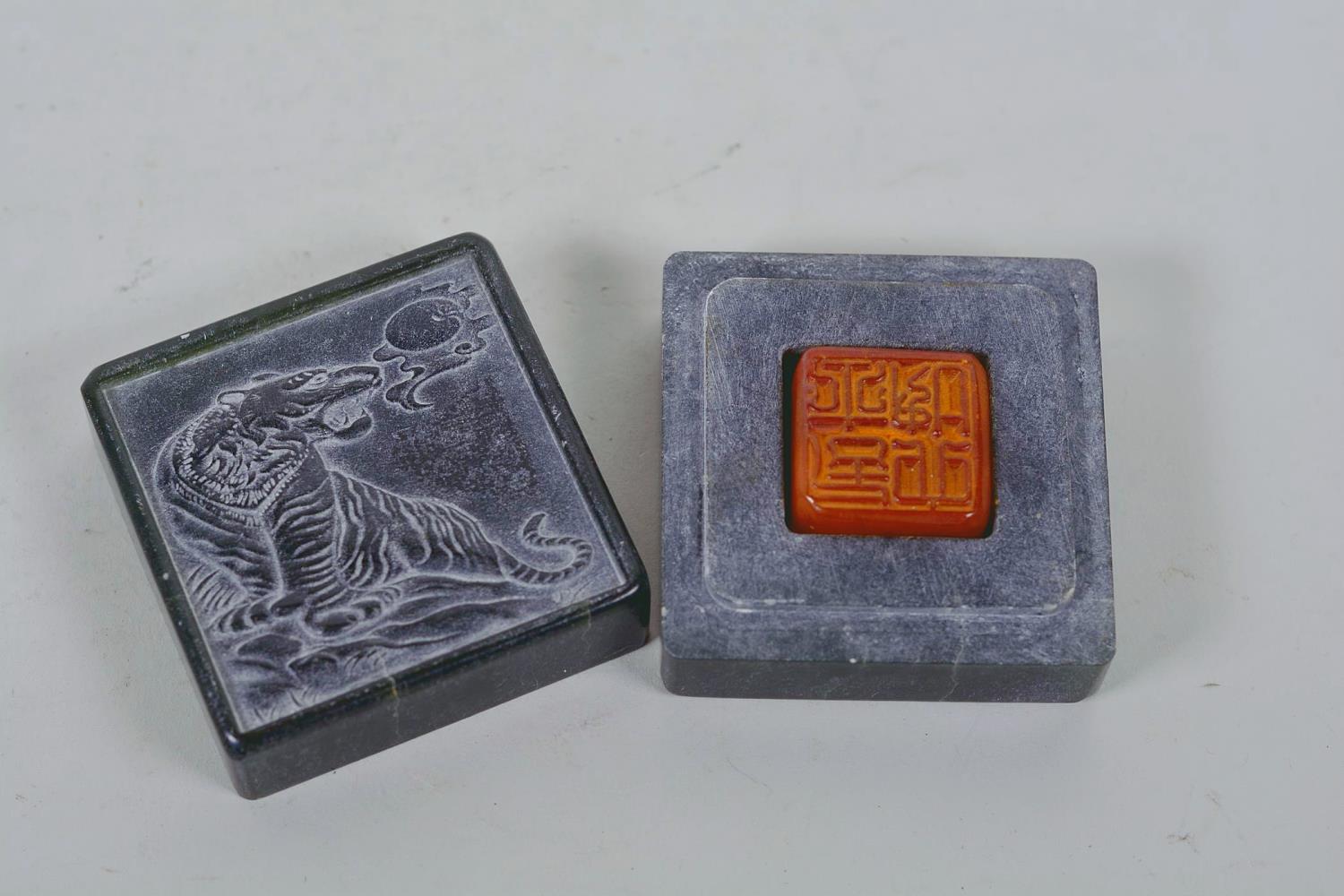 A Chinese green soapstone box containing an amber stone seal, the cover carved with a tiger, 6 - Image 4 of 9