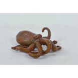 An Oriental bronzed metal octopus, impressed marks to base, 2½" x 3"