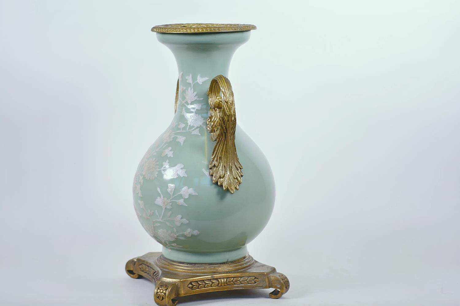 A Chinese celadon glazed porcelain vase with ormolu style mount and raised floral decoration, seal - Image 5 of 13
