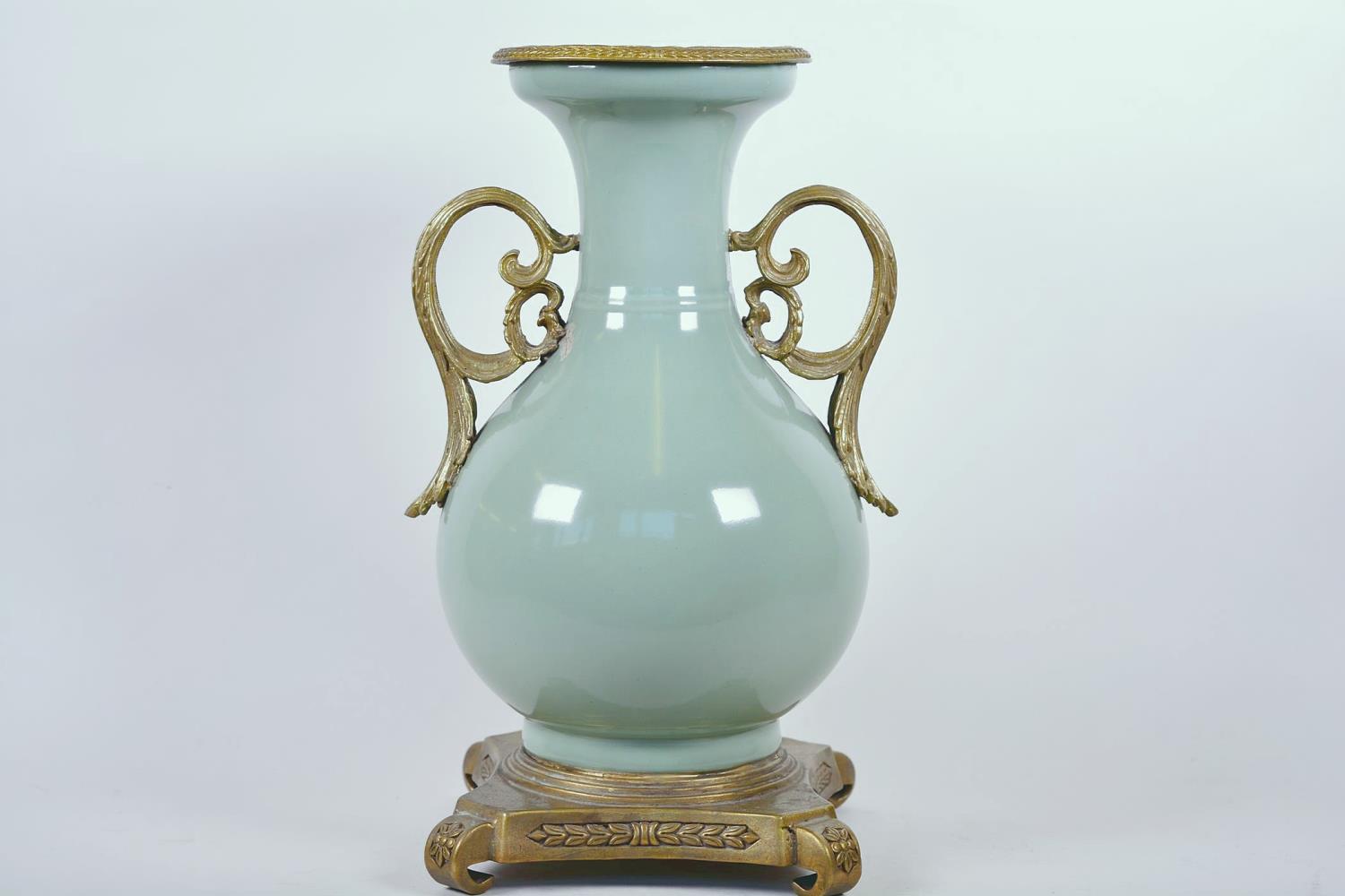A Chinese celadon glazed porcelain vase with ormolu style mount and raised floral decoration, seal - Image 2 of 13