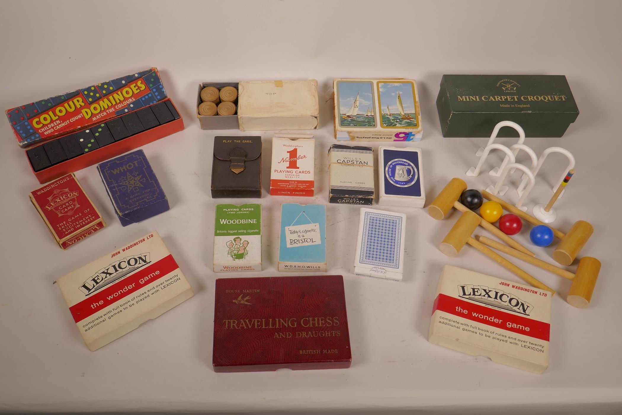 A box of vintage games and playing cards including carpet croquet, dominoes etc