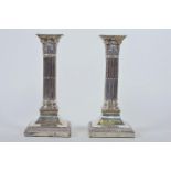 A pair of Edwardian sterling silver Hawksworth, Eyre and Co. Corinthian column candlesticks,