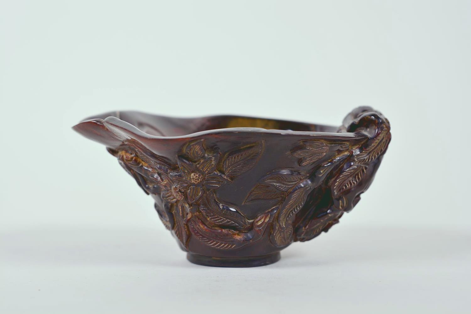 A Chinese faux horn libation cup with carved floral decoration, chased mark to base, 4½" x 6"