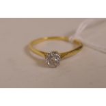 An 18ct gold set solitaire diamond ring, size 'S', gross 2 grams