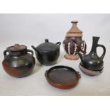 A group of African terracotta pots and vessels, plus a traditional terracotta pot decorated with