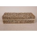 A Chinese white metal scribe's box, having chased and engraved decoration of dragons chasing the