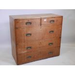 An Army & Navy teak campaign chest in two sections with two short over three long drawers, 39" x