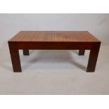 A mahogany occasional table, the top opening to reveal a chessboard, complete with set, 41" x 20"