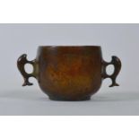 A Chinese bronzed metal censer with two fish shaped handles, impressed seal mark to base, 2" high,