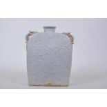 A Chinese rectangular green glazed porcelain flask with embossed decoration of exotic birds and