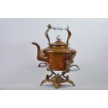 A Victorian copper spirit kettle on stand with milk glass handles, 15½" high