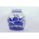 A Chinese blue and white porcelain ginger jar and associated cover, decorated with birds amongst