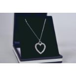 A 9ct white gold, diamond set, heart shaped pendant