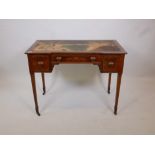 A Victorian Maples & Co. inlaid rosewood writing table, with shaped top and three drawers with