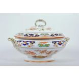 An 1873 Minton stately porcelain oval tureen in the Imari style, with a matching domed lid with