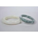 Two Chinese hardstone bangles, largest 2½" diameter