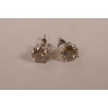 A pair of white gold and champagne diamond stud earrings, total 2cts