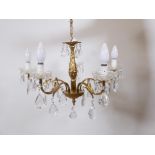 A brass five branch chandelier with crystal drops, 20½" diameter, 24" drop