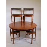 A Tom Robertson for McIntosh teak extending table and four chairs with leather upholstery, 48"