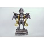 A large silvered metal figure of the bird God Garuda, with gilt and bejewelled decoration, 19½" high