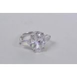 A 925 silver and cubic zirconium set three stone ring, approximate size 'O'