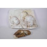 A plaster plaque depicting the busts of the three cherubs, together with a plaster maquette of a