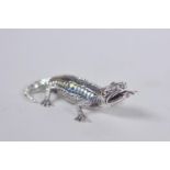 A miniature sterling silver figure of a fire lizard, 2" long