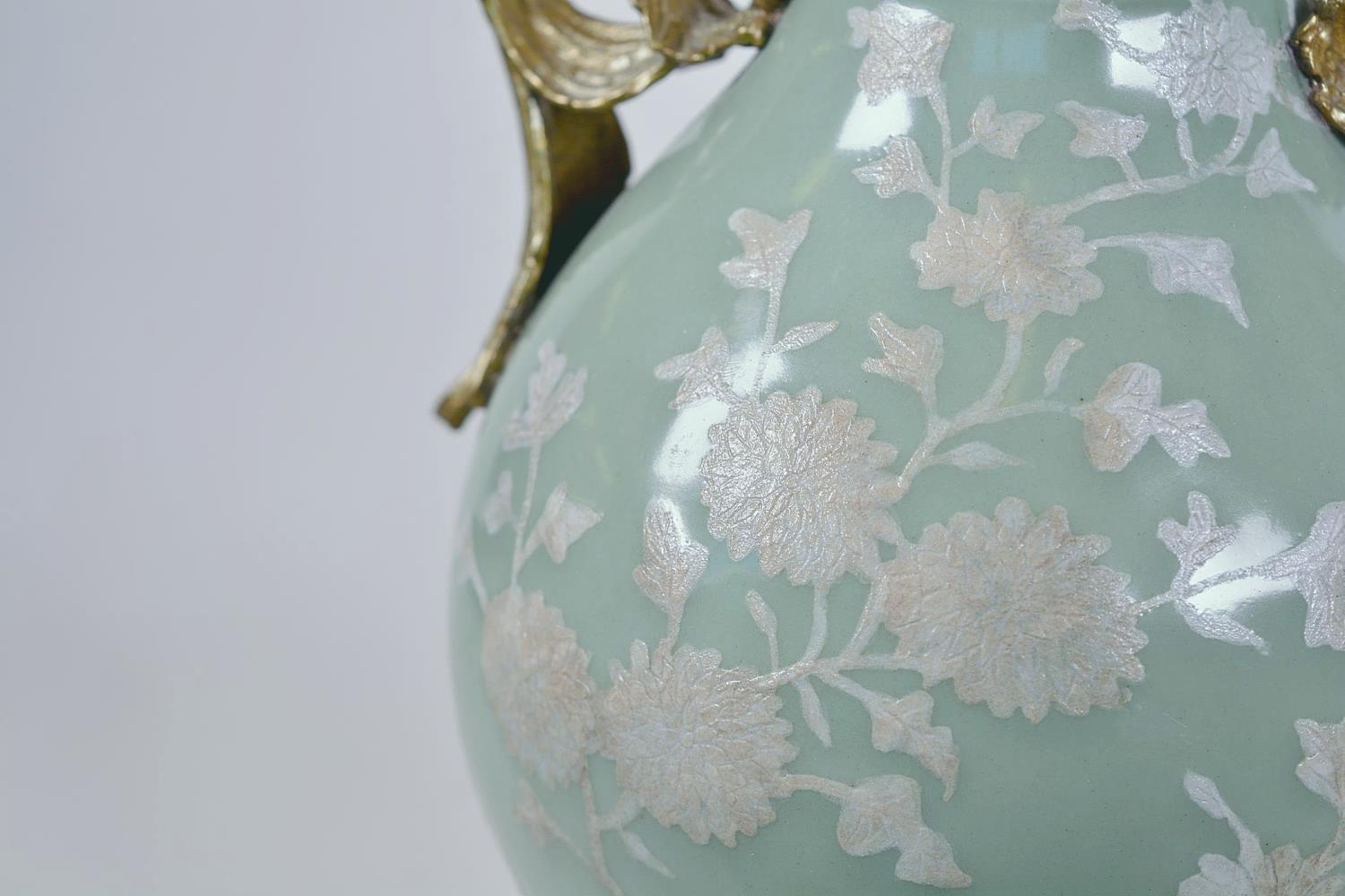 A Chinese celadon glazed porcelain vase with ormolu style mount and raised floral decoration, seal - Image 9 of 13