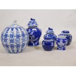 Six Chinese ceramic storage jars with covers, with blue and white decoration, all C20th, largest 10"
