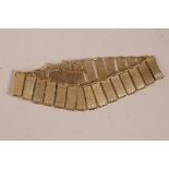 A 9ct gold panel link bracelet, 7½" long with safety chain, 15.2 grams