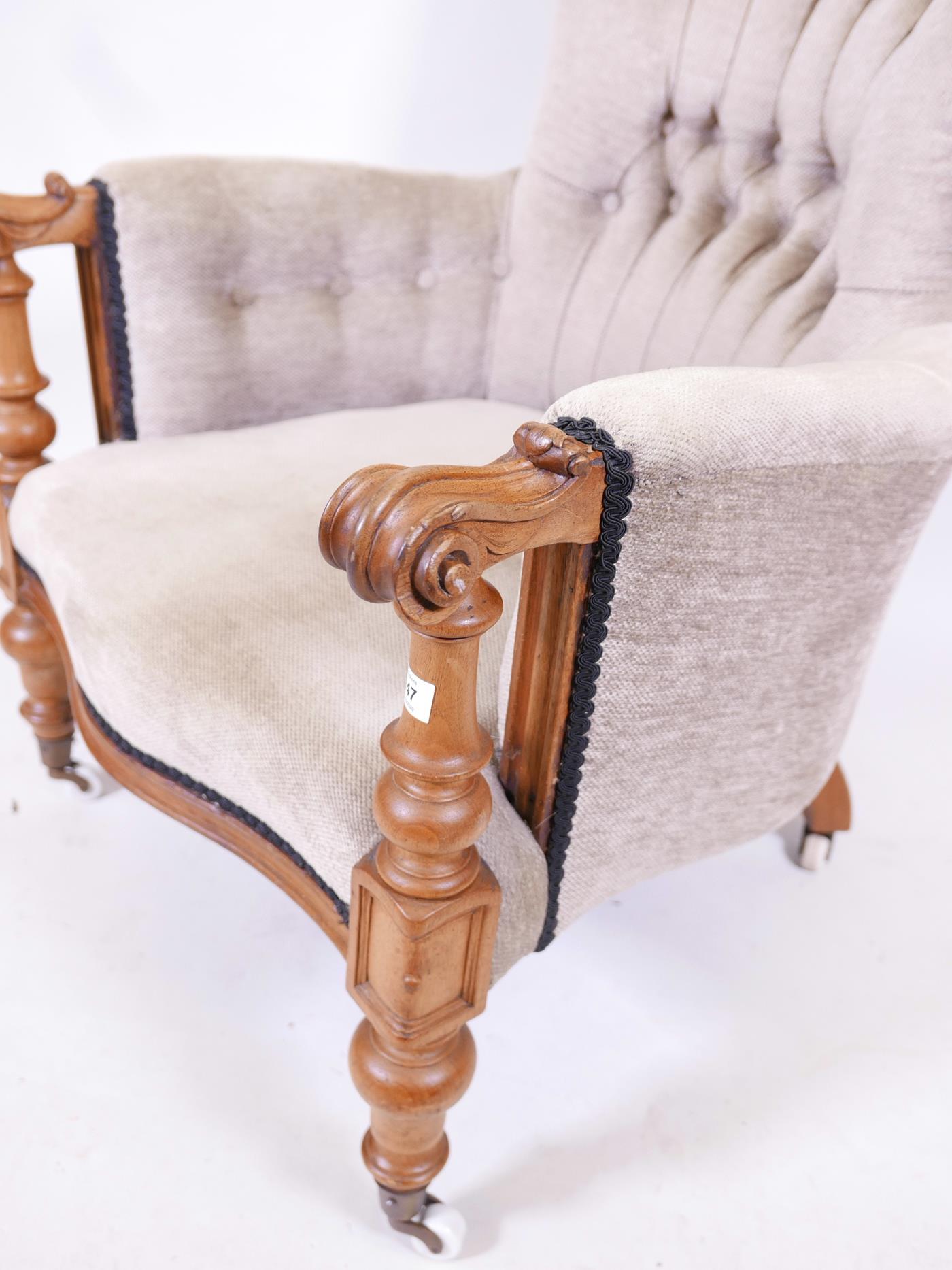 A C19th walnut show frame armchair with scrolled arms and serpentine front, raised on turned - Image 3 of 3