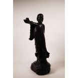 A large Chinese carved hardwood figure of Lohan holding a censer, A/F losses, 26" high