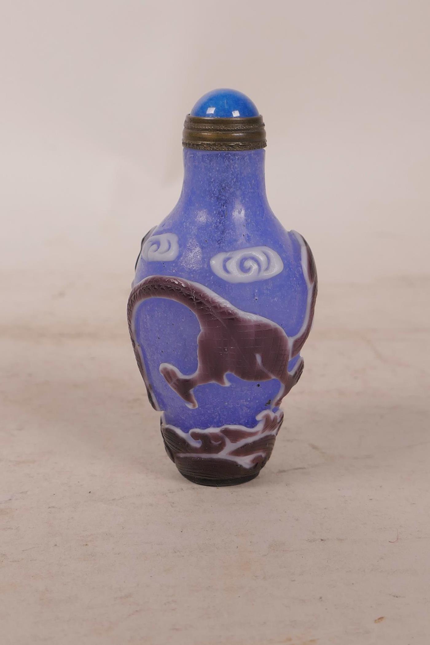 A Chinese carved Peking overlay glass bottle decorated with a dragon, 2½" long - Image 2 of 3