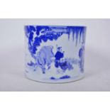 A Chinese blue and white porcelain cylindrical vase/brush pot decorated with travellers on the road,