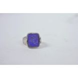 A medieval silver Ottoman ring set with a lapis stone seal carved with a scorpion