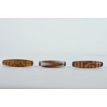 Three Tibetan agate lozenge shaped beads, 2½" long