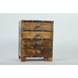A small bound nest of four spice drawers, 8½" x 6½" x 5"