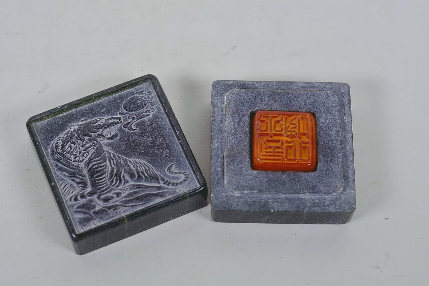 A Chinese green soapstone box containing an amber stone seal, the cover carved with a tiger, 6 - Image 5 of 9